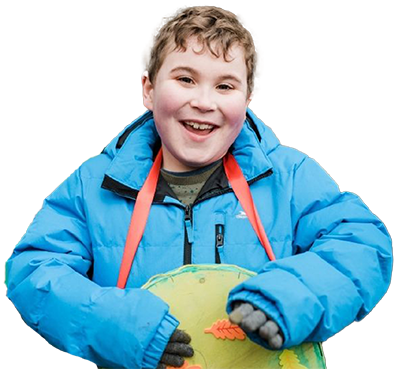 Boy holding handmade crafts